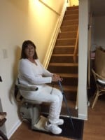 Lifeway-Mobility-customer-riding-Bruno-Elan-stairlift