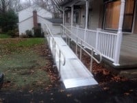 wheelchair ramp leading to front porch of home 