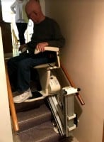 Lifeway-Mobility-Minneapolis-customer-rides-new-Harmar-SL600-stair-lift-equipped-with-power-folding-rail.JPG