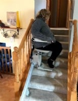 Lifeway-Mobility-Minnesota-customer-riding-her-new-stairlift-for-the-1st-time.JPG