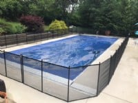 Protect A Child mesh pool fence around clear-covered pool installed by Lifeway Mobility Indianapolis