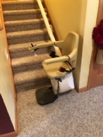 Handicare Freecurve – single rail curved system, at bottom of stairs