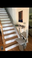 Stairlift-at-bottom-landing-with-arm-rests-folded-up.jpg