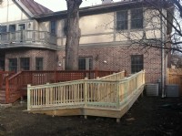Wood wheelchair ramp installed at a local home
