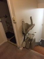 stair-lift-at-top-landing-with-components-folded-up-in-West-Haven-Connecticut-home