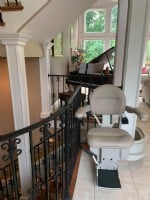 custom curved stairlift with rail overrun at top landing