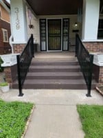 pair-of-handrails-on-outdoor-staircase-for-front-door-access.JPG