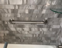 polished-grab-bar-installed-horizontally-in-bath-tub-in-Minnesota-home.JPG