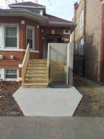 porch lift installed in winter season to provide access to front door of home in Chicago