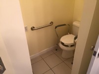 toilet with elevated toilet seat risers and grab bar