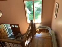 view-of-curved-stairlift-from-top-landing-in-Massachusetts-home.jpg