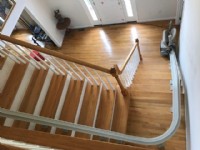 view of curved stairlift from upper level of Massachuetts home