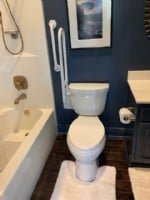 wall mounted toilet safety rail flipped upward