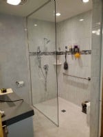 wheelchair-accessible-shower-with-grab-bar-and-glass-shower-door-in-Wheeling-Illinois.jpg