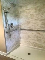 wheelchair accessible shower with horizontal grab bars installed in Massachusetts home