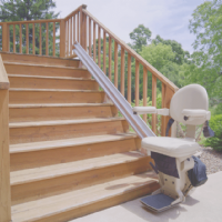 outdoor Bruno Elite stairlift to access deck in backyard of home