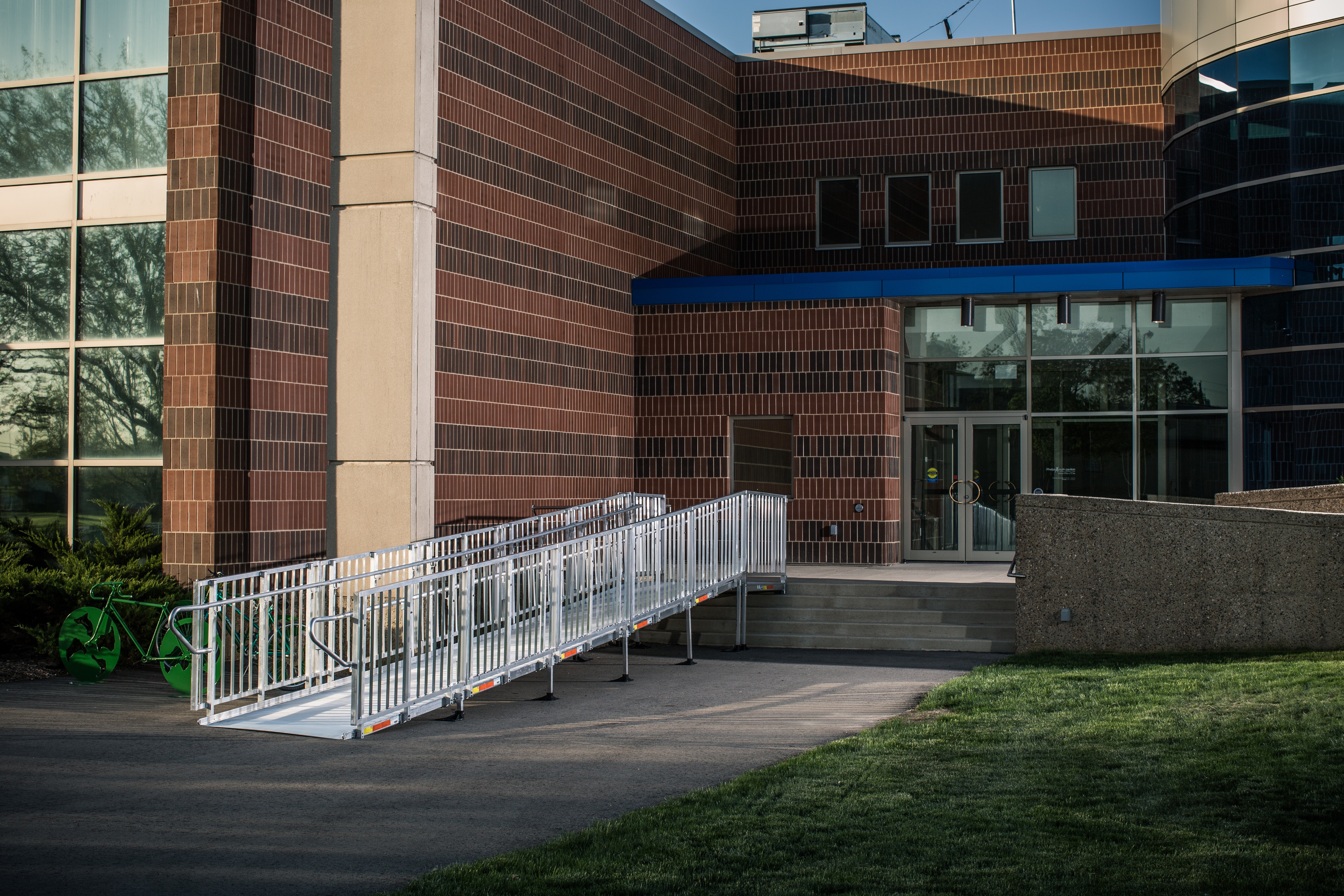 outdoor wheelchair ramp providing safe access to the front entrance of a high school