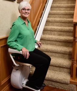 Woman Riding Savaria K2 Stairlift